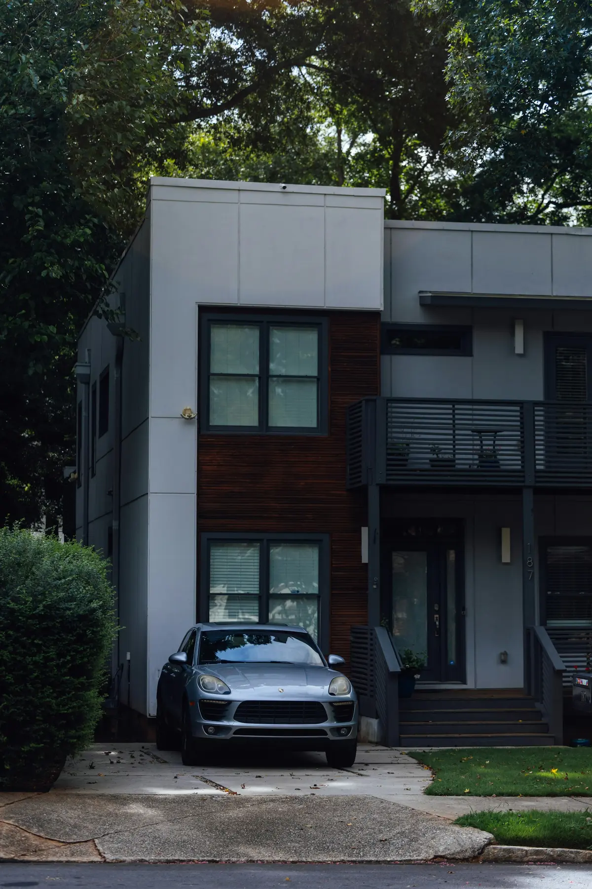 Modern detached home with a landscaped front entrance